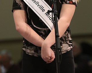        ROBERT K. YOSAY  | THE VINDICATOR.     .Lowellville middle School Bella Eliser ... looks to a higher power  before spelling her word..West Branch eighth grade student Macey Stancato wins the 84th Regional Spelling Bee spelling the championship word "sarcoidosis" correctly..Poland's Sophie Sainato won second place and four-time returnee Angela McKenna from Girard won third place...-30-