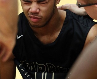 MICHAEL G TAYLOR | THE VINDICATOR- 03-11-17  -Basketball- 3rd qtr., Harding's #0 Tiryn Frank goes down with an injury. D1 District Final- Warren G. Harding Raiders vs Uniontown Lake Blue Streaks at Alliance High School in Alliance, OH