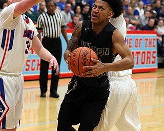 MICHAEL G TAYLOR | THE VINDICATOR- 03-11-17  -Basketball-  1st qtr., Harding's #23 Chris Hughes drives through Lake's #3 Jim Kirven(left) and Lake's #45 Matt Spotleson. D1 District Final- Warren G. Harding Raiders vs Uniontown Lake Blue Streaks at Alliance High School in Alliance, OH