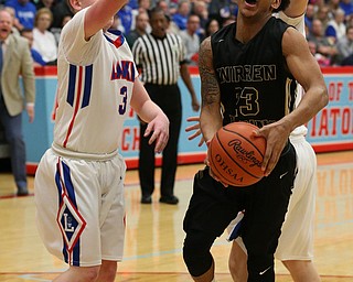 MICHAEL G TAYLOR | THE VINDICATOR- 03-11-17  -Basketball-  1st qtr., Harding's #23 Chris Hughes drives through Lake's #3 Jim Kirven(left) and Lake's #45 Matt Spotleson. D1 District Final- Warren G. Harding Raiders vs Uniontown Lake Blue Streaks at Alliance High School in Alliance, OH