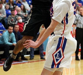 MICHAEL G TAYLOR | THE VINDICATOR- 03-11-17  -Basketball-  1st qtr., Harding's #4 Lynn Bowden shoots over Lake's #33 Mike Spotleson. D1 District Final- Warren G. Harding Raiders vs Uniontown Lake Blue Streaks at Alliance High School in Alliance, OH