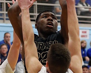 MICHAEL G TAYLOR | THE VINDICATOR- 03-11-17  -Basketball- 2nd qtr., Harding's #32 Terrion Jackson shoots over Lake's #51 Jake Schultz. D1 District Final- Warren G. Harding Raiders vs Uniontown Lake Blue Streaks at Alliance High School in Alliance, OH
