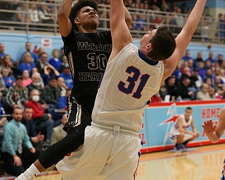 MICHAEL G TAYLOR | THE VINDICATOR- 03-11-17  -Basketball-  2nd qtr, Harding's #30 Mike Hughes drives the lane against Lake's #31 Josh Hutcherson. D1 District Final- Warren G. Harding Raiders vs Uniontown Lake Blue Streaks at Alliance High School in Alliance, OH