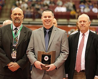Dean Conley from Canfield received the Coach of the Year award for the Division II, The award was presented to Conley at the Ohio High School State Tournament held in Columbus Ohio.  Conley has 6 wrestlers from Canfield competing at the State Tournament this year.  Photo by Mary Beidelschies.