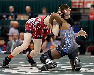 Beaver's Cole McComas, left, works against Cuyahoga Falls Valley Christian Academy's Jacob Decatur in a106 pound championship match during the Division II Ohio state wrestling tournament at the Ohio State University Saturday, March 11, 2017. McComas lost 12-6. (Photo by Paul Vernon)