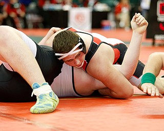 Canfield's Mason Giordano, top, pins River View's Sam Mitchell in a semi-final 285 pound match during the Division II Ohio state wrestling tournament at the Ohio State University Friday, March 10, 2017. (Photo by Paul Vernon)