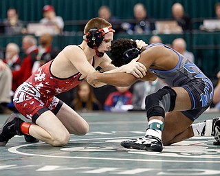 Beaver's Cole McComas, left, works against Cuyahoga Falls Valley Christian Academy's Jacob Decatur in a106 pound championship match during the Division II Ohio state wrestling tournament at the Ohio State University Saturday, March 11, 2017. McComas lost 12-6. (Photo by Paul Vernon)
