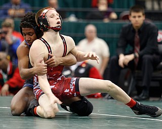 Beaver's Cole McComas, right, works against Cuyahoga Falls Valley Christian Academy's Jacob Decatur in a106 pound championship match during the Division II Ohio state wrestling tournament at the Ohio State University Saturday, March 11, 2017. McComas lost 12-6. (Photo by Paul Vernon)
