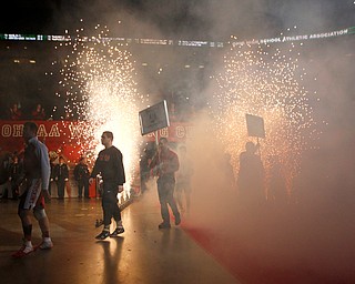 Canfield's Mason Giordano, second from left, walks out during the Parade of Champions before the start of the Ohio state wrestling championships at the Ohio State University Saturday, March 11, 2017. (Photo by Paul Vernon)