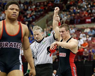 Canfield's David Crawford, right, is declared the winner against Perkins' Keysean Amison, left, in a semi-final 170 pound match during the Division II Ohio state wrestling tournament at the Ohio State University Friday, March 10, 2017. (Photo by Paul Vernon)