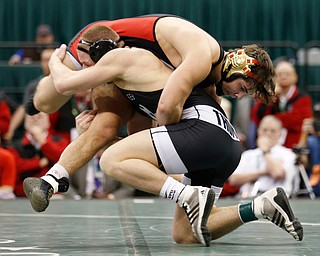 Canfield's Georgio Poullas, top, works against Graham Local's Ryan Thomas during a 160 pound championship match during the Division II Ohio state wrestling tournament at the Ohio State University Saturday, March 11, 2017. (Photo by Paul Vernon)