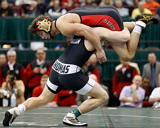 Canfield's Georgio Poullas, top, works against Graham Local's Ryan Thomas during a 160 pound championship match during the Division II Ohio state wrestling tournament at the Ohio State University Saturday, March 11, 2017. (Photo by Paul Vernon)