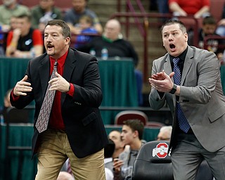 Canfield coaches Dave Crawford, left, and Dean Conley direct David Crawford in a 170 pound championship match against New Lexington's Dimitri Williams  during the Division II Ohio state wrestling tournament at the Ohio State University Saturday, March 11, 2017. Crawford won in overtime. (Photo by Paul Vernon)