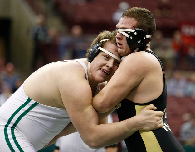 West Branch's Ian Sharp, left, works against Canfield's Mason Giordano in a 285 pound championship match during the Division II Ohio state wrestling tournament at the Ohio State University Saturday, March 11, 2017. Sharp won the match. (Photo by Paul Vernon)