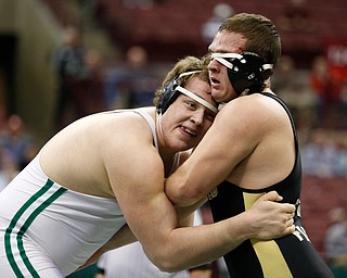 West Branch's Ian Sharp, left, works against Canfield's Mason Giordano in a 285 pound championship match during the Division II Ohio state wrestling tournament at the Ohio State University Saturday, March 11, 2017. Sharp won the match. (Photo by Paul Vernon)