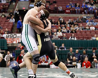 West Branch's Ian Sharp, left, works against Canfield's Mason Giordano in a 285 pound championship match during the Division II Ohio state wrestling tournament at the Ohio State University Saturday, March 11, 2017. Sharp won the match. (Photo by Paul Vernon)
