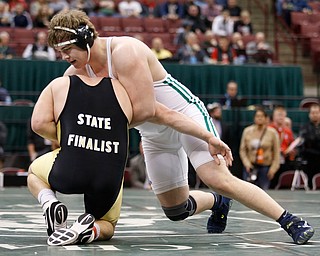 West Branch's Ian Sharp, right, works against Canfield's Mason Giordano in a 285 pound championship match during the Division II Ohio state wrestling tournament at the Ohio State University Saturday, March 11, 2017. Sharp won the match. (Photo by Paul Vernon)