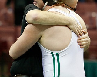West Branch's Ian Sharp, left,  celebrates a 285 pound championship match win over Canfield's Mason Giordano with his father and coach Rodger Sharp during the Division II Ohio state wrestling tournament at the Ohio State University Saturday, March 11, 2017. (Photo by Paul Vernon)