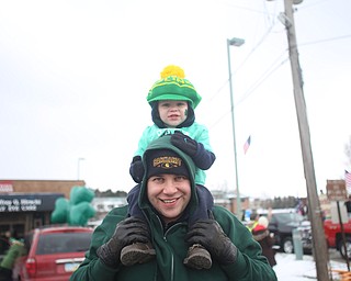 Adam Chasko of Boardman hoists his son, Collin, 2, on his shoulders during the Mahoning Valley St. Patrick's Day Parade on Market Street in Boardman, Sunday, March 12, 2017. ..(Nikos Frazier | The Vindicator)..