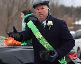 2017 Grand Marshal Edward Reese throws candy at onlookers during the Mahoning Valley St. Patrick's Day Parade on Market Street in Boardman, Sunday, March 12, 2017. ..(Nikos Frazier | The Vindicator)..