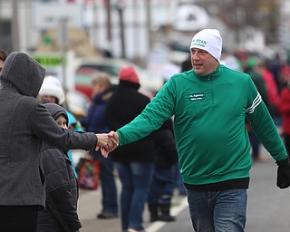 Rep. Tim Ryan(D-Ohio 13) shakes hands with spectators during the Mahoning Valley St. Patrick's Day Parade on Market Street in Boardman, Sunday, March 12, 2017. ..(Nikos Frazier | The Vindicator)..