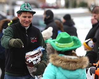Ohio State Rep. John Boccieri(D-Ohio 59) passes out candy to spectators during the Mahoning Valley St. Patrick's Day Parade on Market Street in Boardman, Sunday, March 12, 2017. ..(Nikos Frazier | The Vindicator)..
