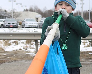 Matthew Guarnieri, 6, of Boardman plays the Vuvuzela during the Mahoning Valley St. Patrick's Day Parade on Market Street in Boardman, Sunday, March 12, 2017. ..(Nikos Frazier | The Vindicator)..