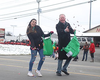 Judge Scott Hunter(right) and step-daughter Jessica Barone throw candy to onlookers during the Mahoning Valley St. Patrick's Day Parade on Market Street in Boardman, Sunday, March 12, 2017. ..(Nikos Frazier | The Vindicator)..