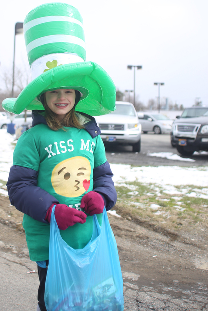 Evalyn O'Leary, 12, of Poland smiles during the Mahoning Valley St. Patrick's Day Parade on Market Street in Boardman, Sunday, March 12, 2017. ..(Nikos Frazier | The Vindicator)..