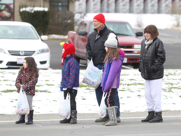 Michelle and Jim Vitullo of Austintown stand with their grandkids; Theresa, 8, Quintin, 7, Christy, 4, Hunter during the Mahoning Valley St. Patrick's Day Parade on Market Street in Boardman, Sunday, March 12, 2017. ..(Nikos Frazier | The Vindicator)..