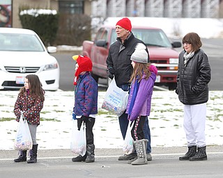 Michelle and Jim Vitullo of Austintown stand with their grandkids; Theresa, 8, Quintin, 7, Christy, 4, Hunter during the Mahoning Valley St. Patrick's Day Parade on Market Street in Boardman, Sunday, March 12, 2017. ..(Nikos Frazier | The Vindicator)..