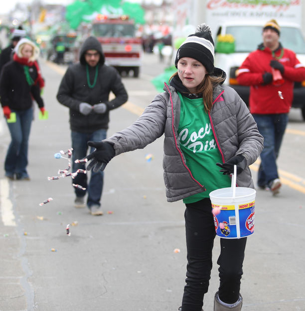 Reagan Smith, 12 throws out candy to spectators for Cocca Pizza during the Mahoning Valley St. Patrick's Day Parade on Market Street in Boardman, Sunday, March 12, 2017. ..(Nikos Frazier | The Vindicator)..