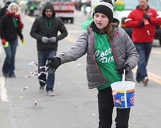 Reagan Smith, 12 throws out candy to spectators for Cocca Pizza during the Mahoning Valley St. Patrick's Day Parade on Market Street in Boardman, Sunday, March 12, 2017. ..(Nikos Frazier | The Vindicator)..
