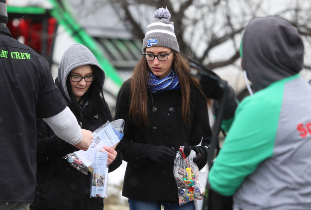 Hailey Boyer(right), 15, and Alivia Stefek, 15 of Poland receive candy during the Mahoning Valley St. Patrick's Day Parade on Market Street in Boardman, Sunday, March 12, 2017. ..(Nikos Frazier | The Vindicator)..