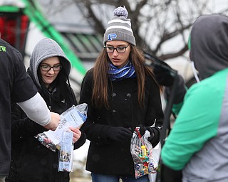 Hailey Boyer(right), 15, and Alivia Stefek, 15 of Poland receive candy during the Mahoning Valley St. Patrick's Day Parade on Market Street in Boardman, Sunday, March 12, 2017. ..(Nikos Frazier | The Vindicator)..