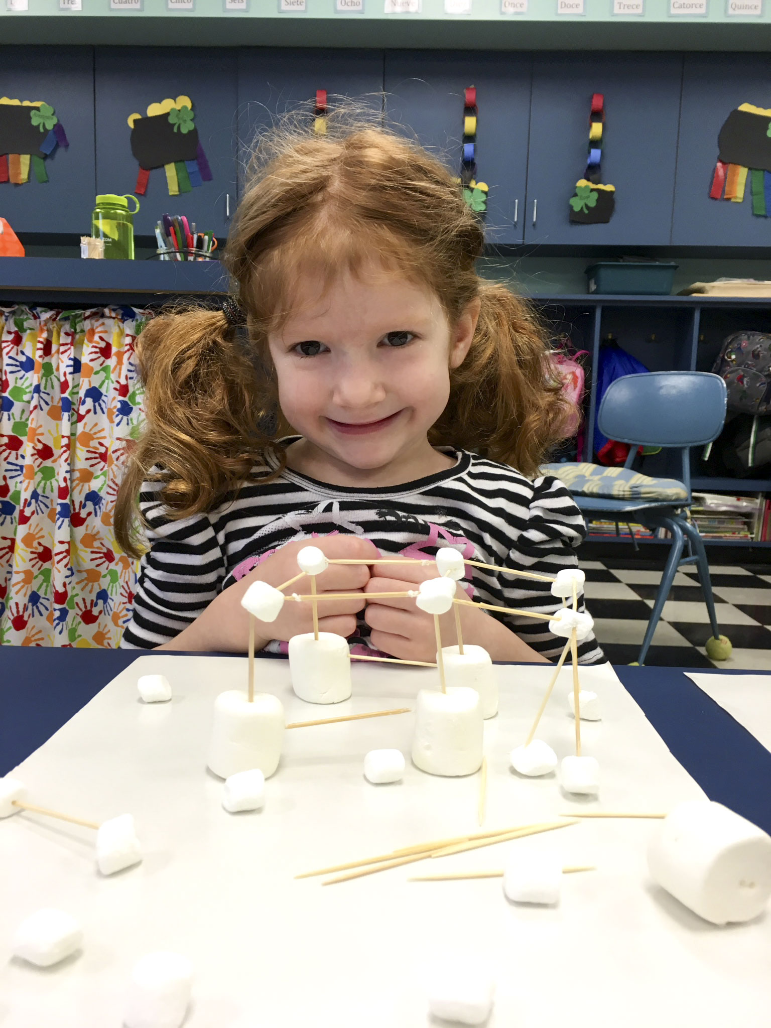 SPECIAL TO THE VINDICATOR
Rose Kearns, left, and Ryder Davis, below, students of Barbara Conti’s enrichment class at Ursuline Preschool and Kindergarten in Canfield, used marshmallows and toothpicks as building materials during the class’s scholastic book fair. The theme of the fair was “Camp Out With a Good Book.”