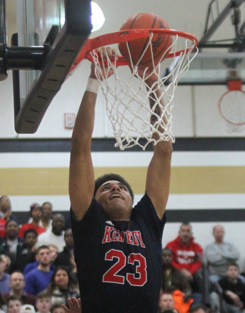 William d Lewis the Vindicator  JFK's Antonio McQueen(23) dunks during 4th qtr of win over McDoanld.