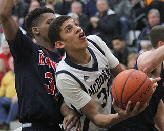 William d Lewis the Vindicator  McDoanld's Braedon Poole(30) shoots past JFK's Nate woods(31).