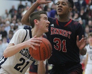 William d Lewis the Vindicator  McDonald's Joey Ragazzine(21) shoots past JFK's Nate Woods(31).