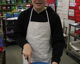 Neighbors | Abby Slanker.A C.H. Campbell Elementary School third-grader took his turn mixing the hot chocolate mixture with a wisk during the school’s Hot Chocolate Shoppe on Feb. 2.