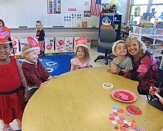 Neighbors | Alexis Bartolomucci.Students in Joy Bucci's class at Poland North made Valentine's Day hats out of paper plates they decorated.