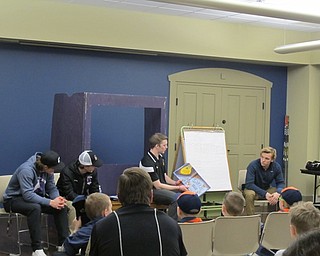 Neighbors | Alexis Bartolomucci.Some of the Youngstown Phantom hockey players read books to children at the Boardman library on Feb. 21.