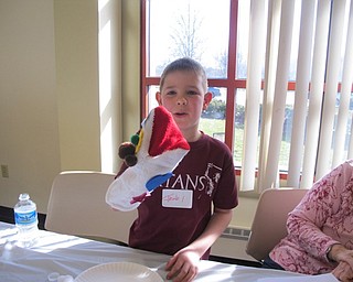 Neighbors | Alexis Bartolomucci.Jacob showed off his socket puppet he made during the Boardman library puppet program on Feb. 20.