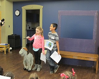 Neighbors | Alexis Bartolomucci.Two children put on the play "Three Billy Goats Gruff," during the Puppet Project program at the Boardman library on Feb. 20.