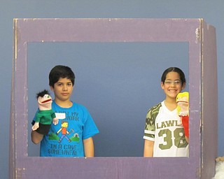 Neighbors | Alexis Bartolomucci.Two of the children at the Puppet Project program at the Boardman library on Feb. 20 used puppets to put on a performance of "The Goat in the Chile Patch."