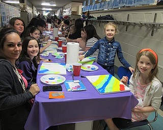 Neighbors | Alexis Bartolomucci.Daughters and their mothers worked on painting their canvas during the Cupcakes and Canvas event at Dobbins Elementary on Feb. 23.