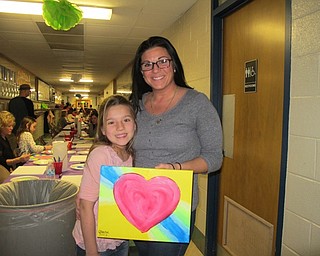 Neighbors | Alexis Bartolomucci.Jolene and Alaina Ihnat showed off their finish canvas painting they made during the Cupcakes and Canvas event at Dobbins Elementary on Feb. 23.