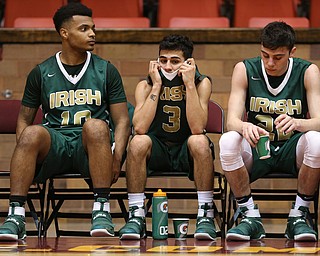 MICHAEL G TAYLOR | THE VINDICATOR- 03-16-17  -Basketball-  4th qtr, on the bench, Ursuline's #10 Dawalyn Washington, #3 Anise Algahmee and #22 Vince Venzeio react to Ursuline's loss .  D2 Regional Semi Final-  Ursuline Irish vs Cleve Central Catholic Iromen at Canton Memorial Civic Center in Canton, OH