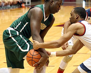 MICHAEL G TAYLOR | THE VINDICATOR- 03-16-17  -Basketball-  1st qtr, Ursuline's #1 Anthony Howell and  Ironmen's #0 Delshawn Jackson battle for the loose ball.  D2 Regional Semi Final-  Ursuline Irish vs Cleve Central Catholic Iromen at Canton Memorial Civic Center in Canton, OH