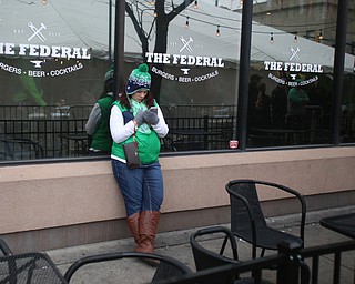 Lindsey Bisconti of Cuyahoga Falls waits outside of The Federal during Sham-Rock on the Block, Friday, March 17, 2017, in downtown Youngstown. ..(Nikos Frazier | The Vindicator)..